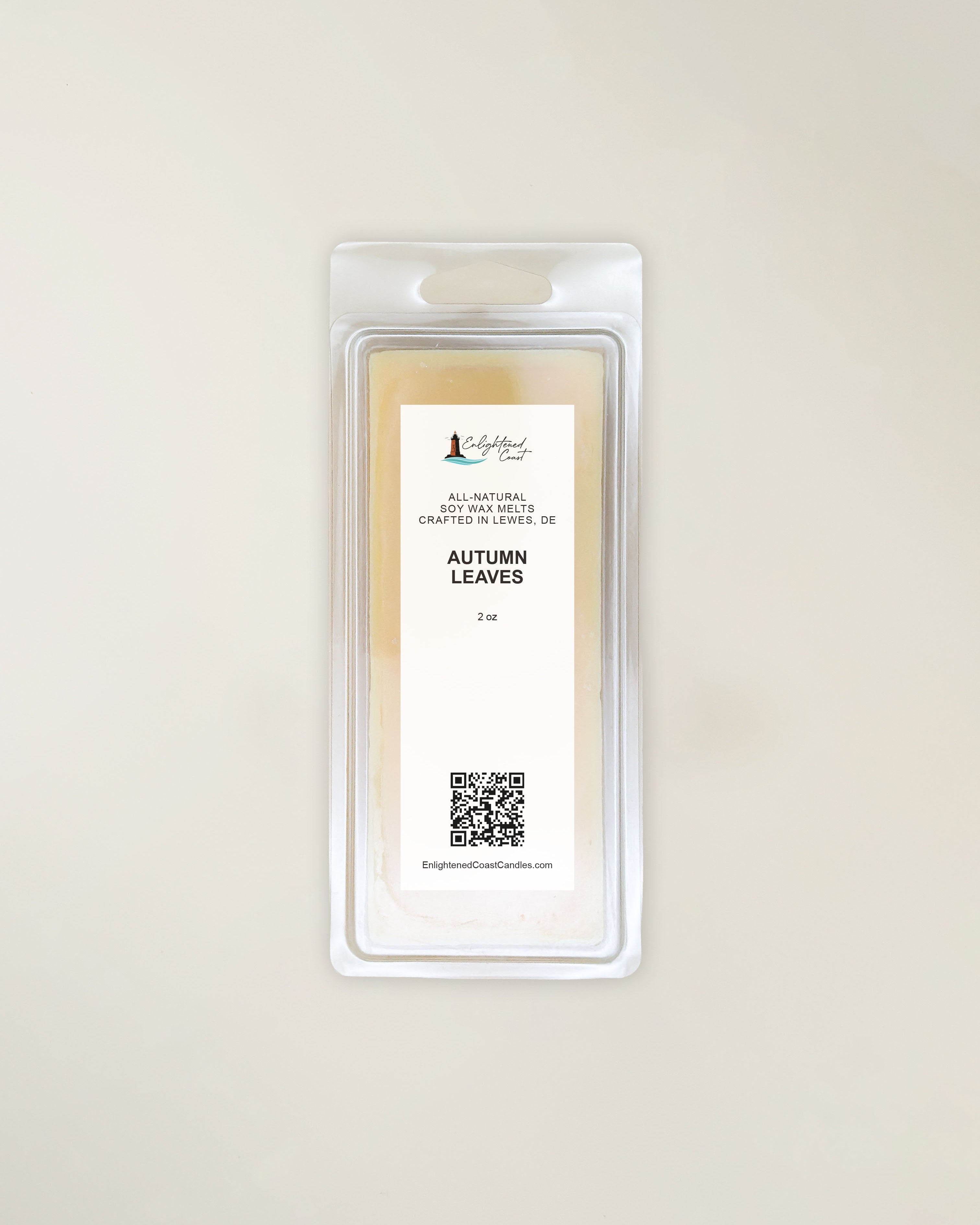 Packaged wax melt with 'Autumn Leaves' scent on a beige background