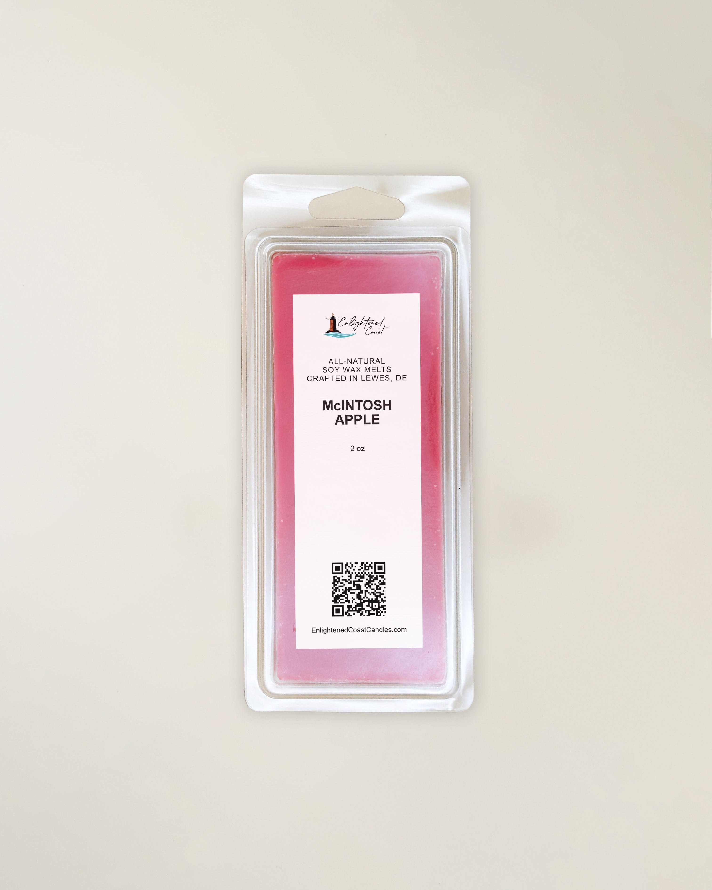 Packaged wax melt with a McIntosh Apple label on a light beige background