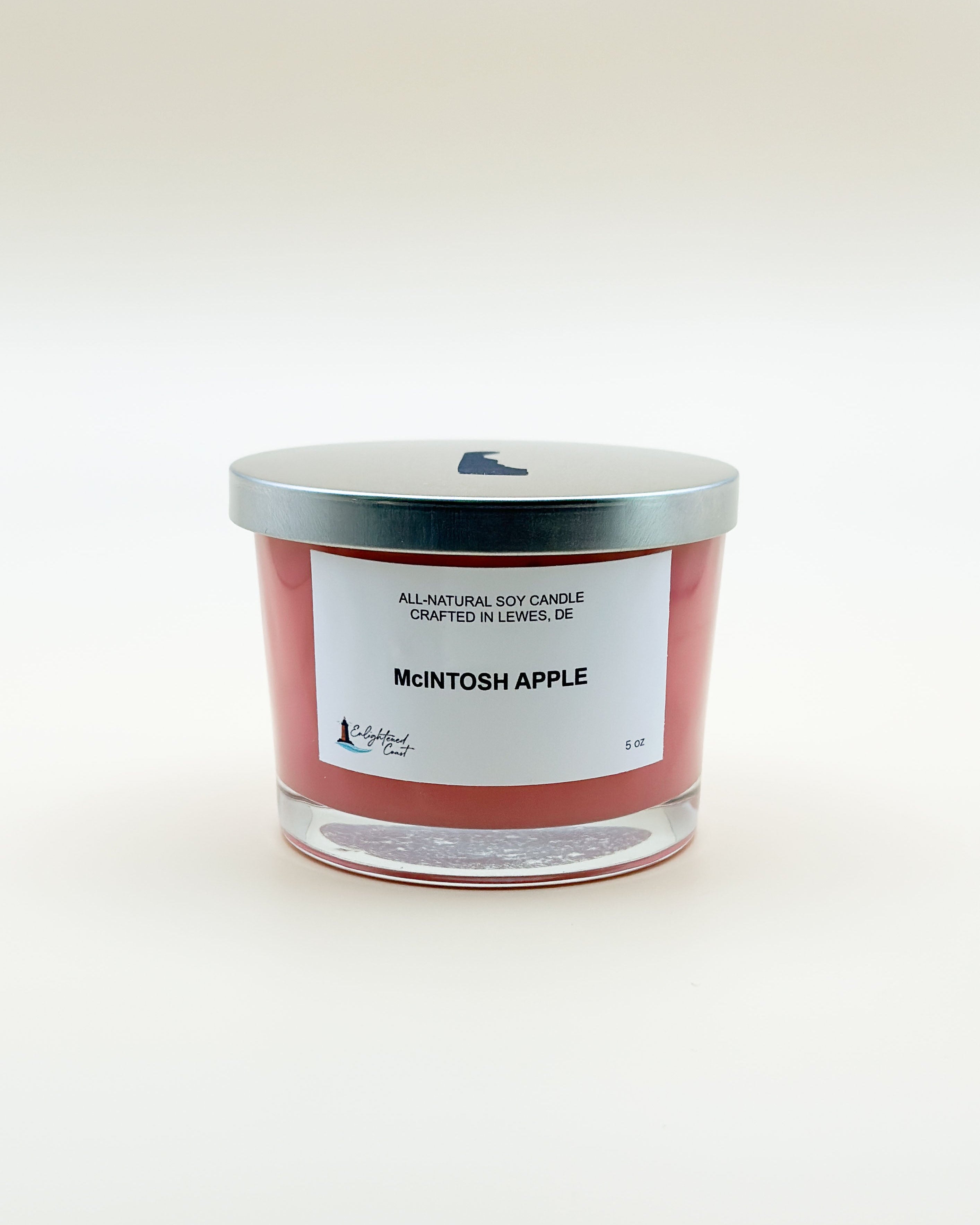Candle with a McIntosh Apple label on a white background