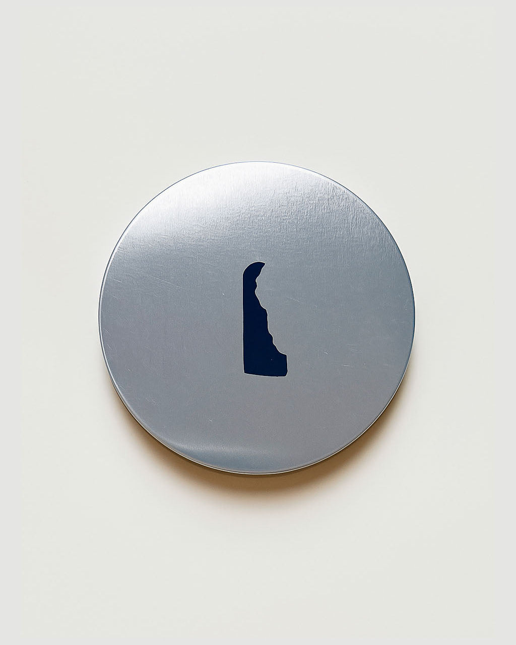 Silver candle lid with delaware state match strike