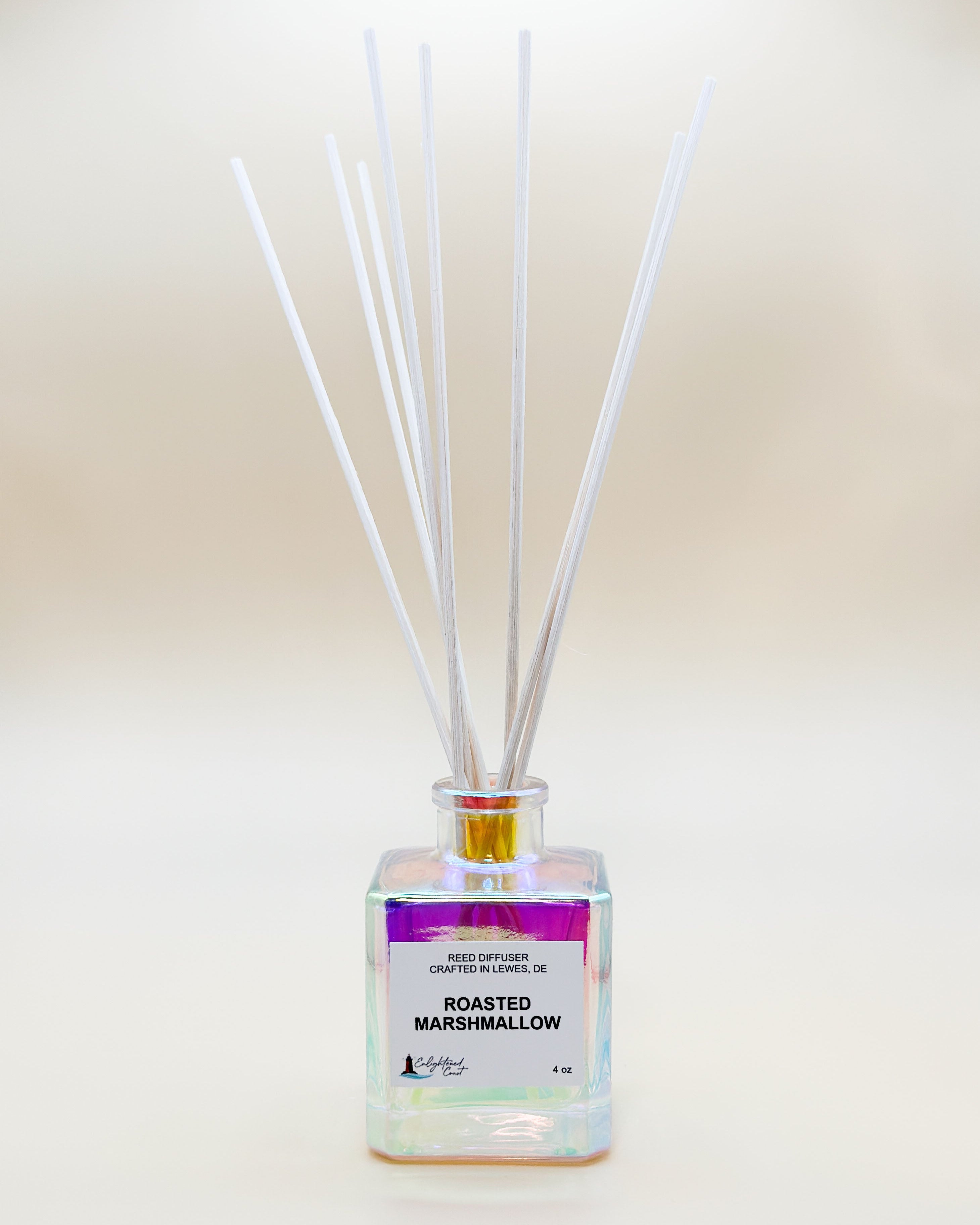 Reed diffuser with 'Roasted Marshmallow' fragrance on a plain background