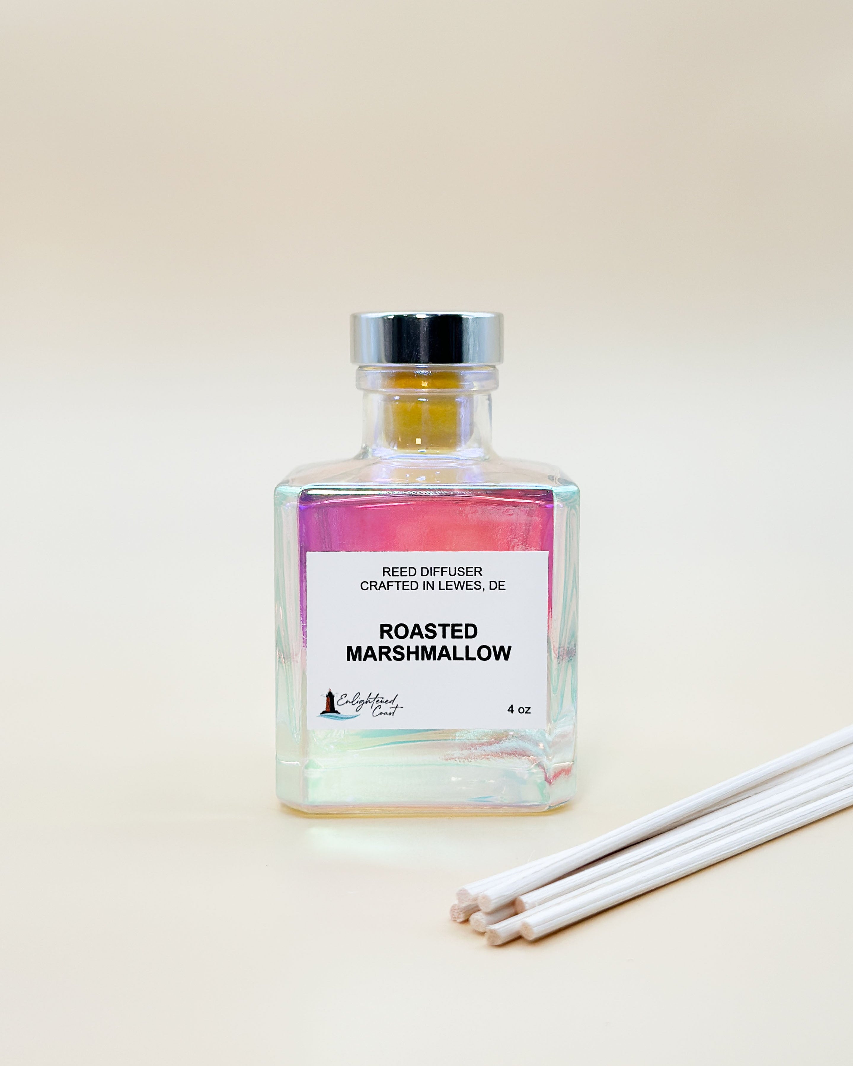 Reed diffuser labeled 'Roasted Marshmallow' with reeds on a light background