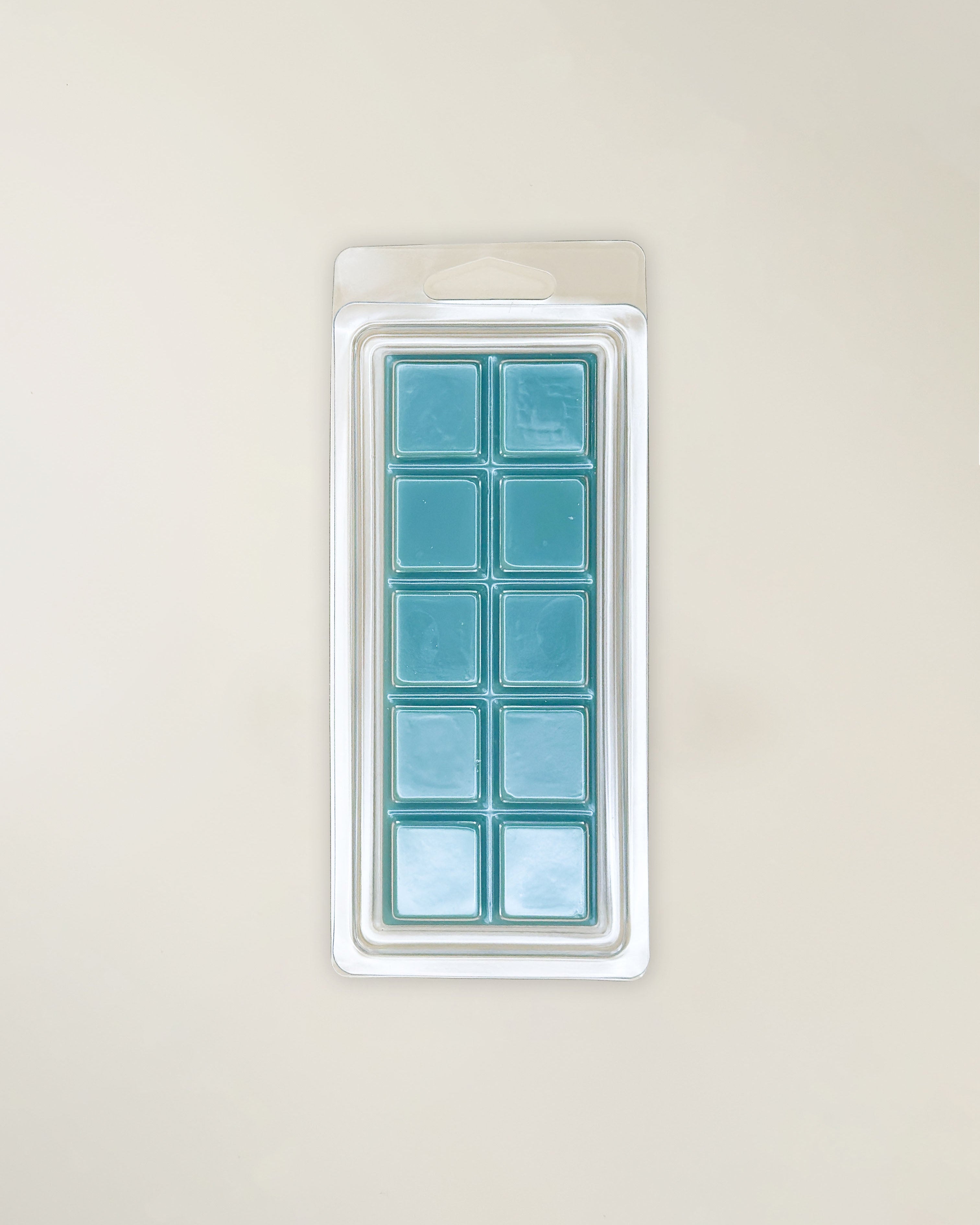 Back of wax melt package with teal wax