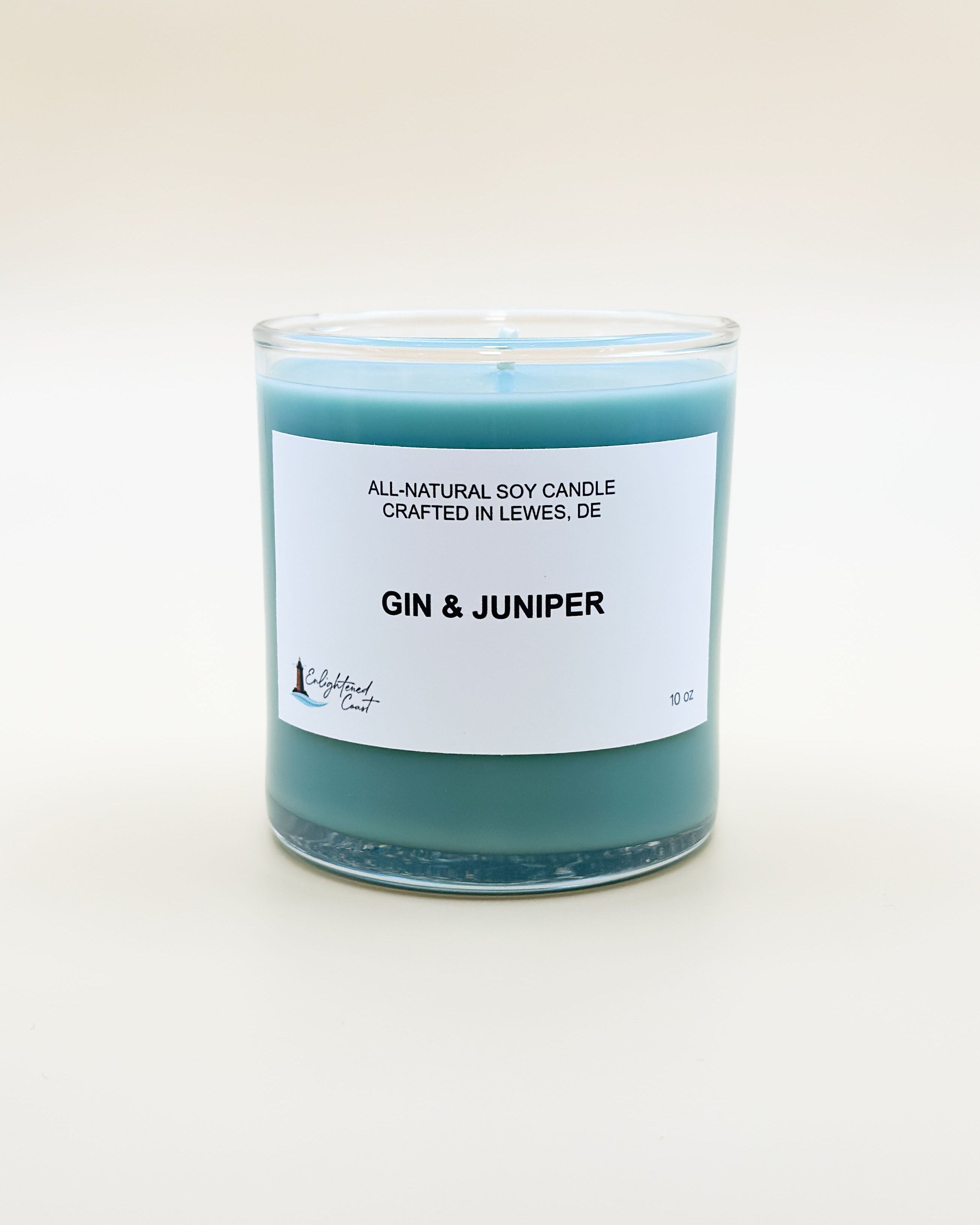 Soy candle labeled 'Gin & Juniper' on a white background