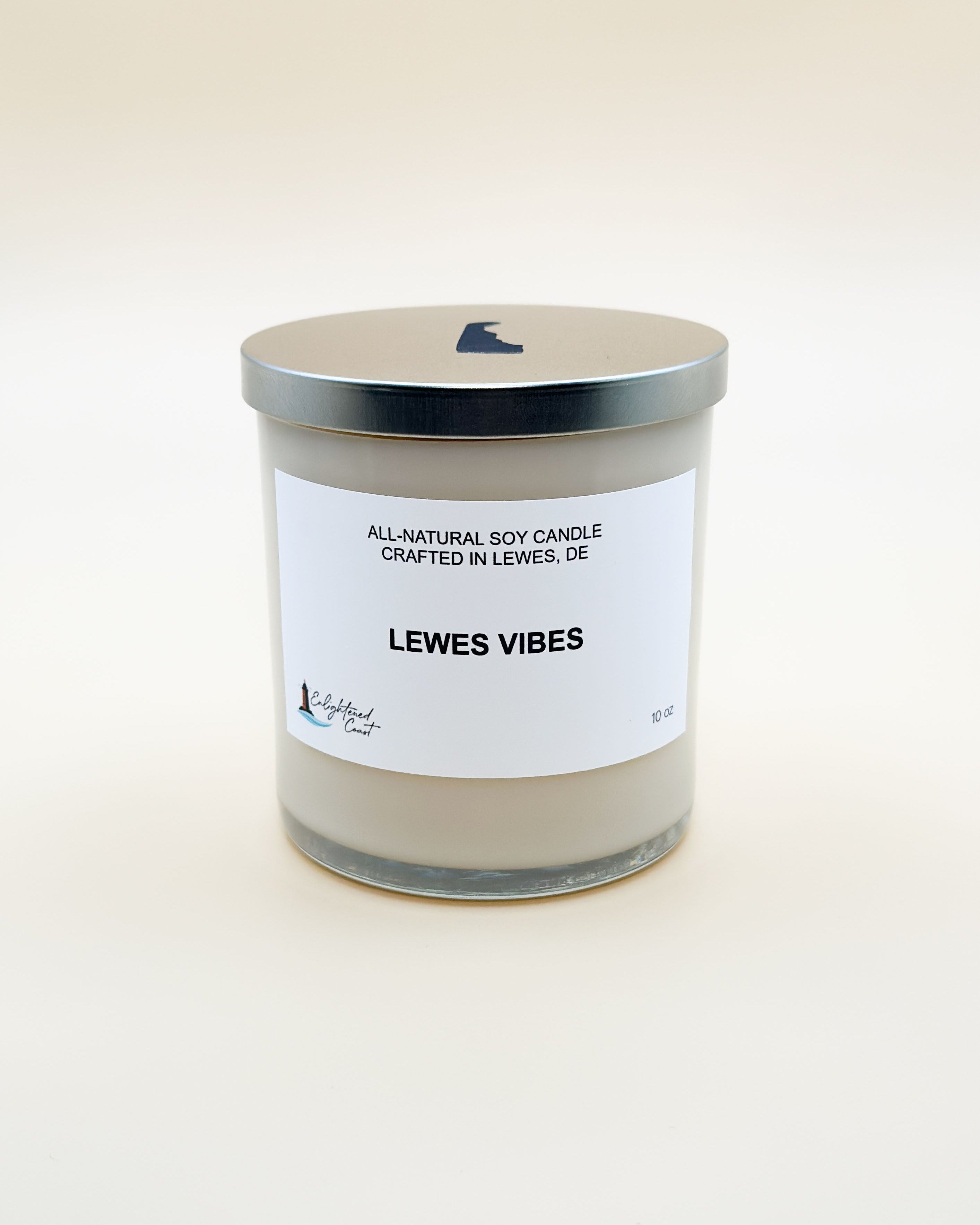 Candle with a label reading 'Lewes Vibes' on a white background