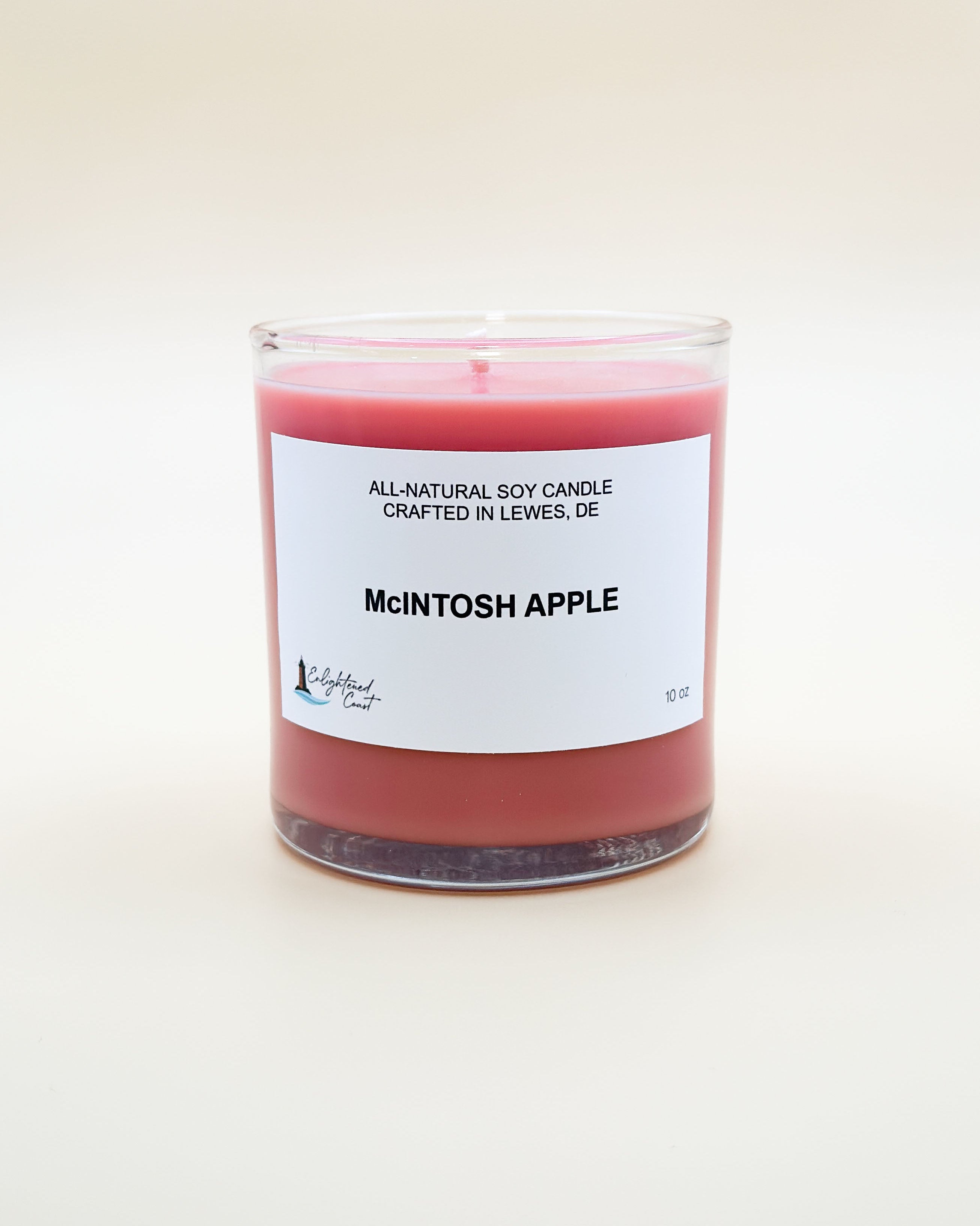 Candle labeled 'McIntosh Apple' with a white label on a light background