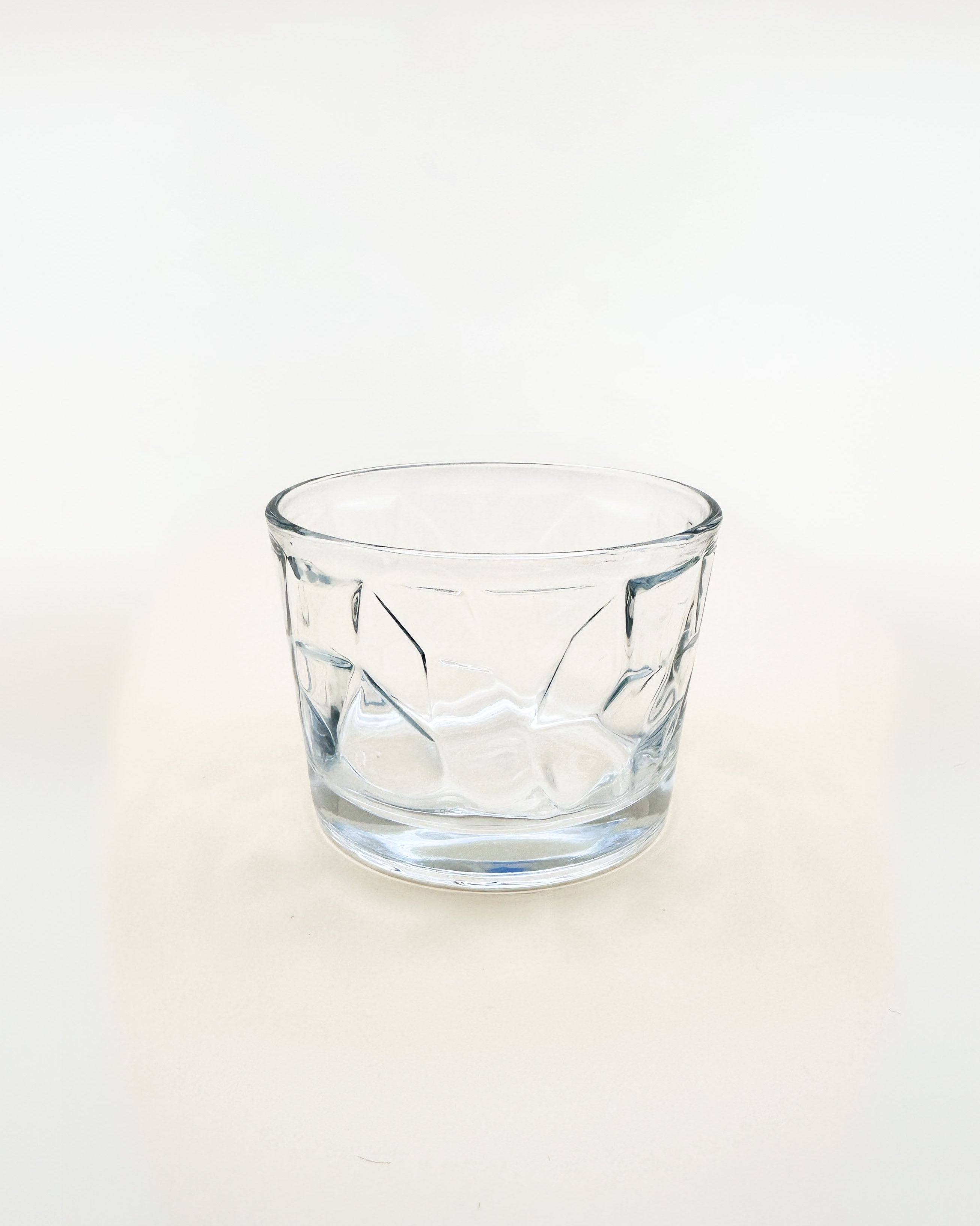 Clear glass tumbler on a white background