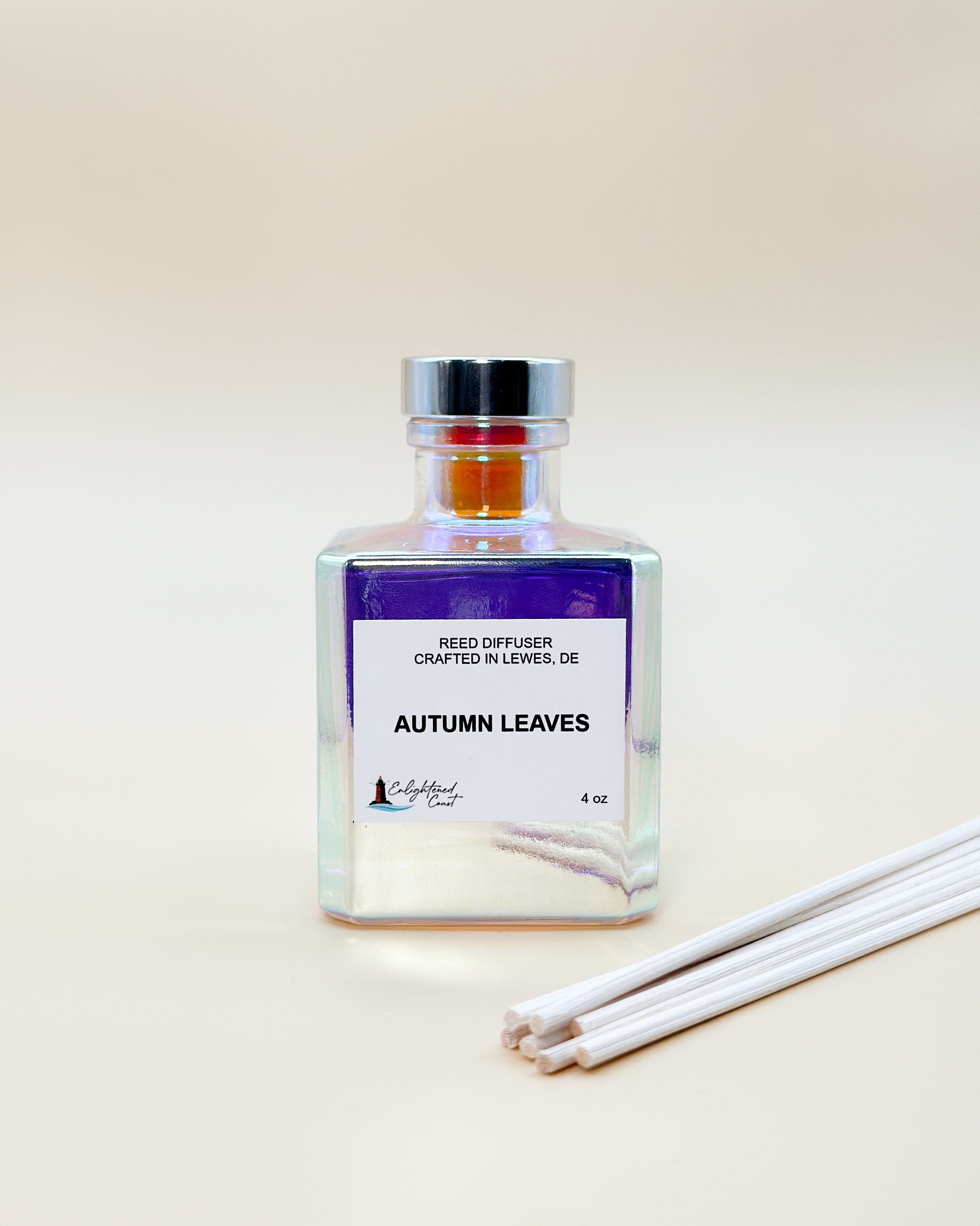 Reed diffuser bottle labeled 'Autumn Leaves' on a light background