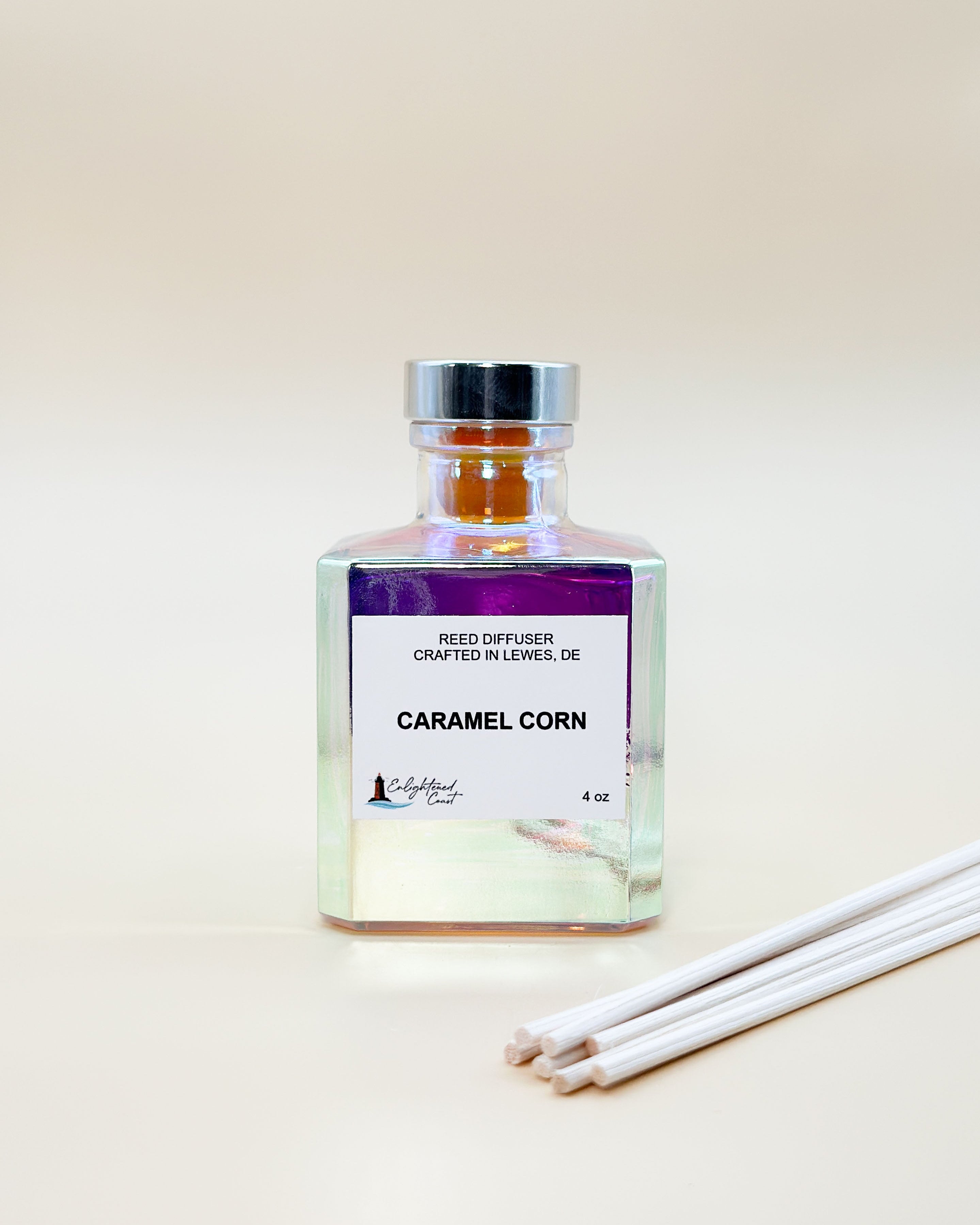 Reed diffuser with 'Caramel Corn' fragrance on a light background